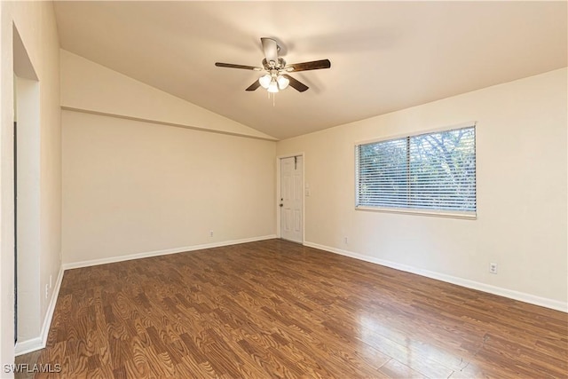 unfurnished room with lofted ceiling, dark hardwood / wood-style floors, and ceiling fan