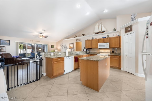 kitchen with a kitchen island, sink, light stone counters, kitchen peninsula, and white appliances