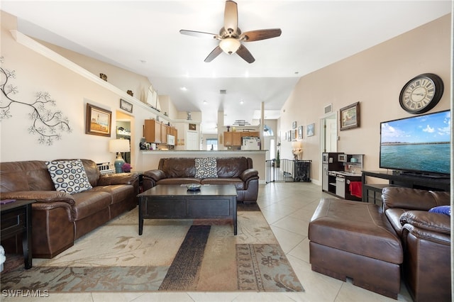 tiled living room featuring vaulted ceiling and ceiling fan