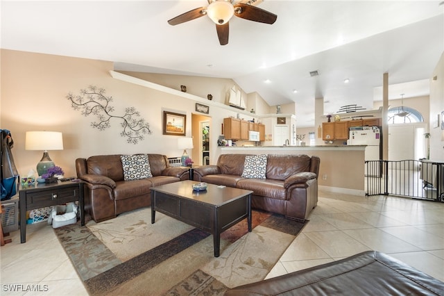 living room featuring light tile patterned flooring, lofted ceiling, and ceiling fan