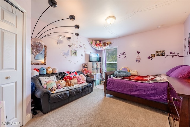 bedroom featuring light carpet