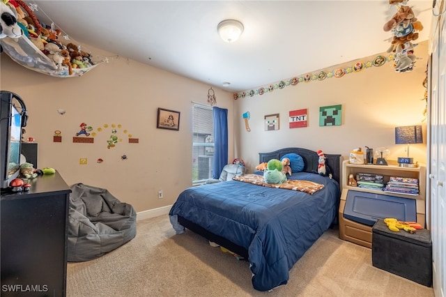 bedroom featuring light carpet