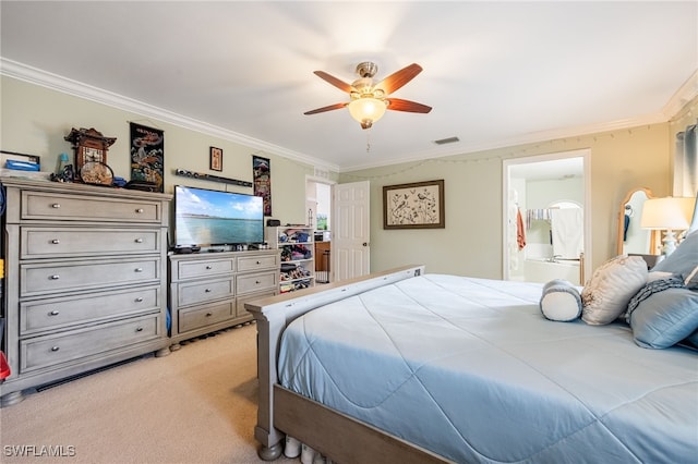 bedroom with crown molding, light colored carpet, ensuite bathroom, and ceiling fan