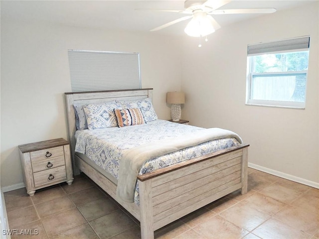 bedroom featuring light tile patterned flooring and ceiling fan