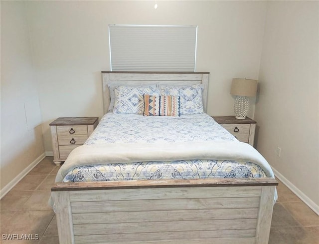 bedroom featuring light tile patterned floors