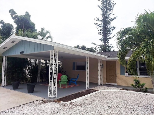 exterior space with a carport