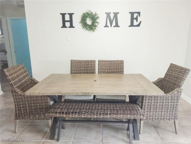 dining space featuring tile patterned flooring