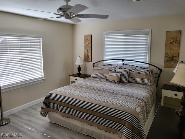 bedroom featuring ceiling fan and light wood-type flooring