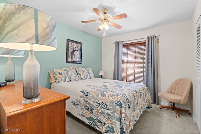 bedroom with ceiling fan, a closet, and carpet