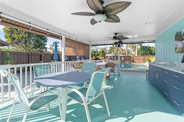 view of pool with ceiling fan