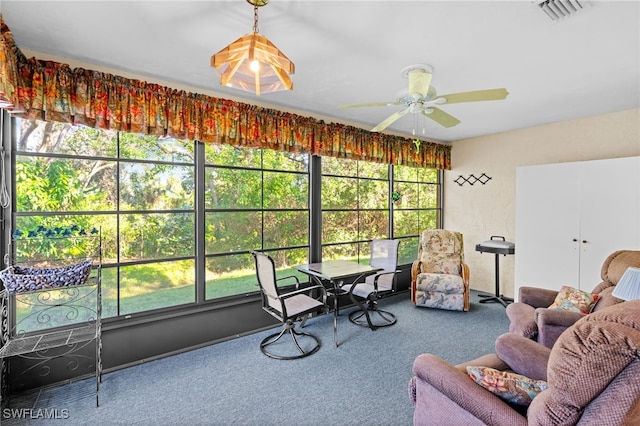 sunroom with ceiling fan