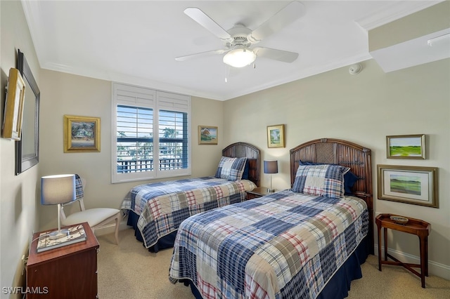 bedroom featuring crown molding, ceiling fan, and light carpet