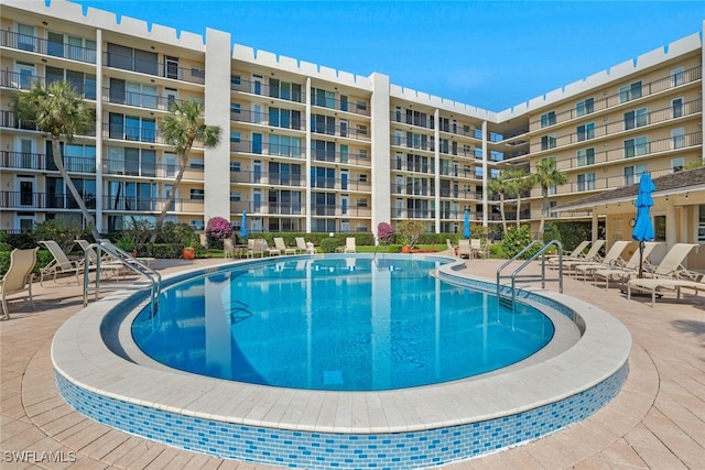 view of swimming pool featuring a patio area