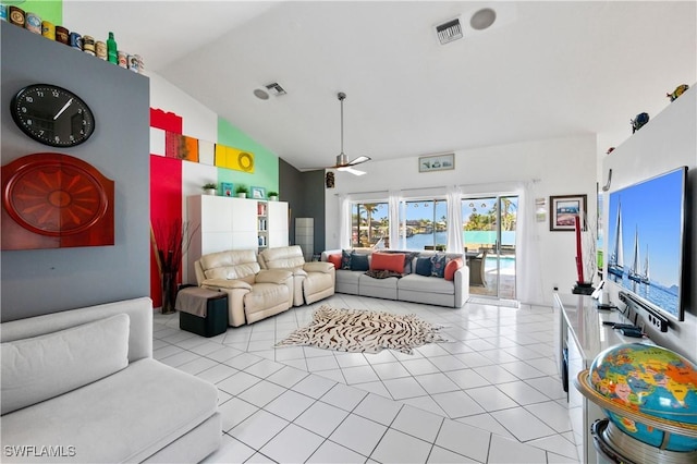 tiled living room featuring vaulted ceiling and ceiling fan