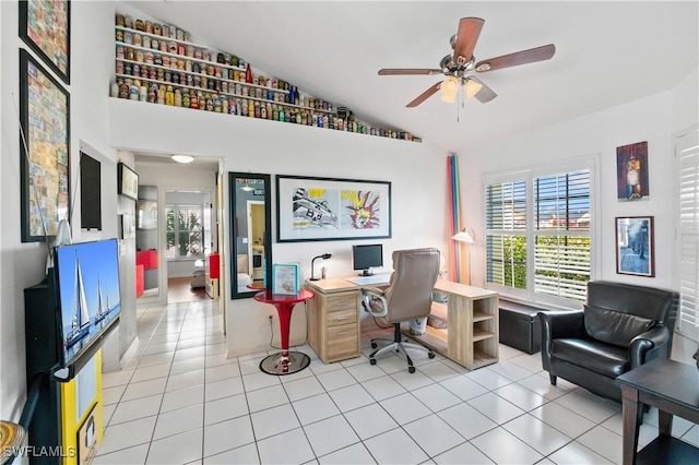 tiled office space with ceiling fan, lofted ceiling, and plenty of natural light