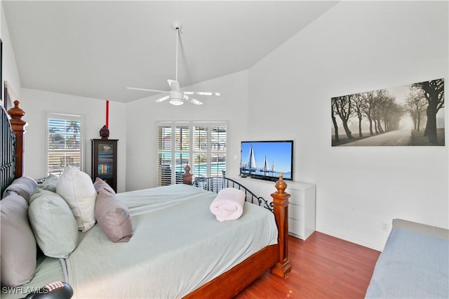 bedroom featuring wood-type flooring, lofted ceiling, and ceiling fan