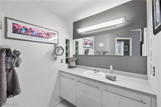 bathroom featuring vanity and lofted ceiling