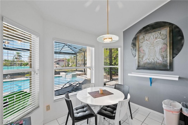 dining area featuring light tile patterned floors