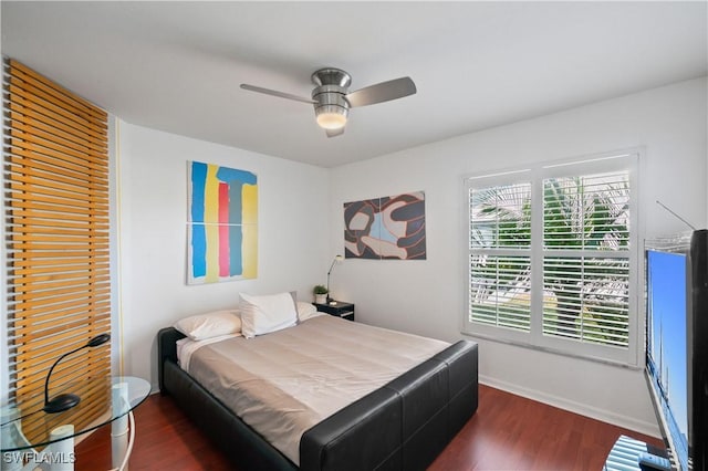 bedroom featuring dark wood-type flooring and ceiling fan