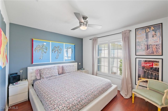 bedroom featuring dark wood-type flooring and ceiling fan