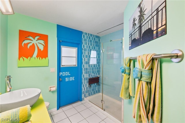 bathroom featuring vanity, an enclosed shower, tile patterned floors, and toilet