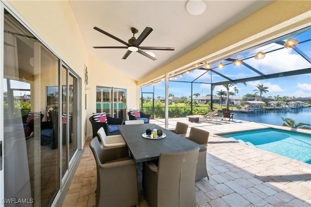 exterior space with a water view, ceiling fan, and a lanai