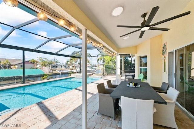 view of pool featuring a patio and glass enclosure