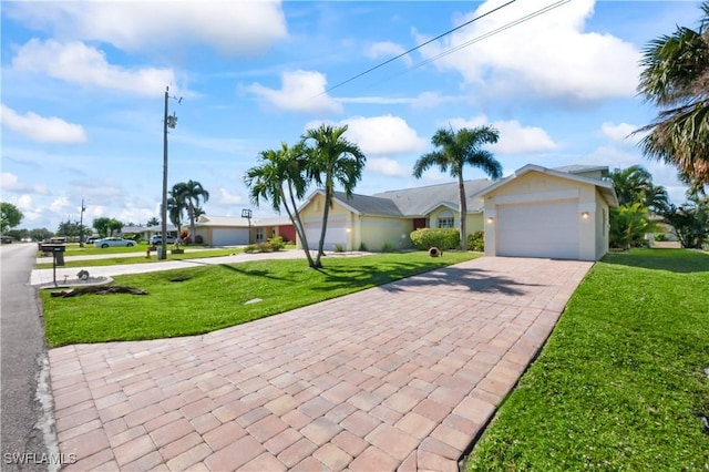 single story home with a garage and a front yard