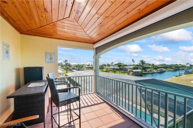 balcony featuring a water view