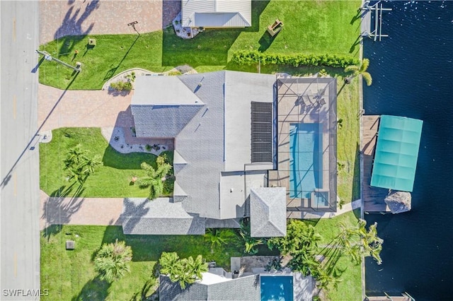 birds eye view of property with a water view