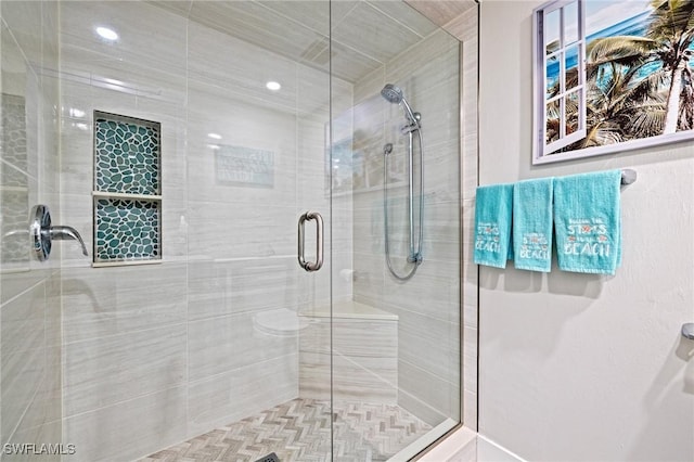 bathroom featuring an enclosed shower