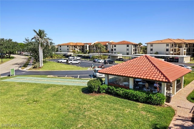 view of home's community with a lawn