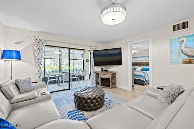 living room with light hardwood / wood-style floors