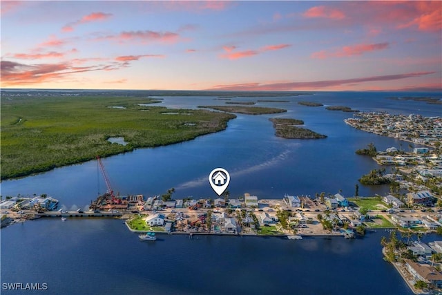 aerial view at dusk with a water view