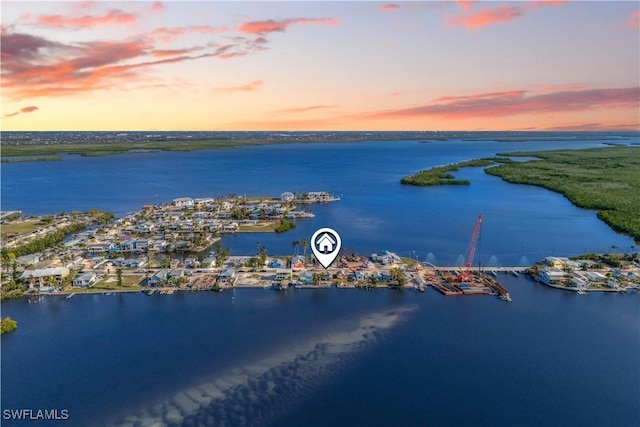 aerial view at dusk with a water view