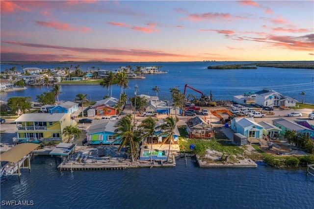 aerial view at dusk with a water view