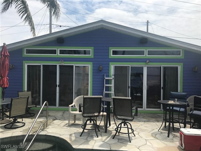 back of house with a patio area