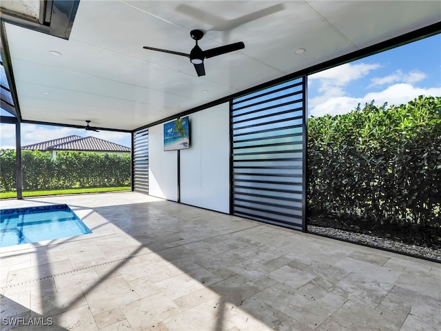 outdoor pool with a patio and ceiling fan