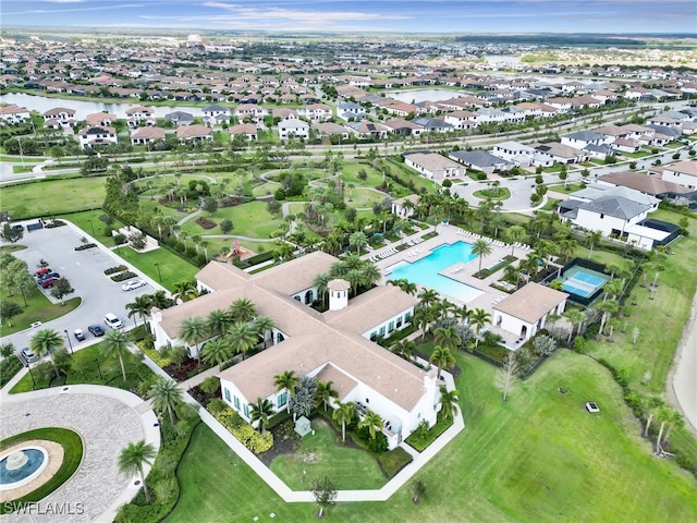bird's eye view featuring a water view and a residential view