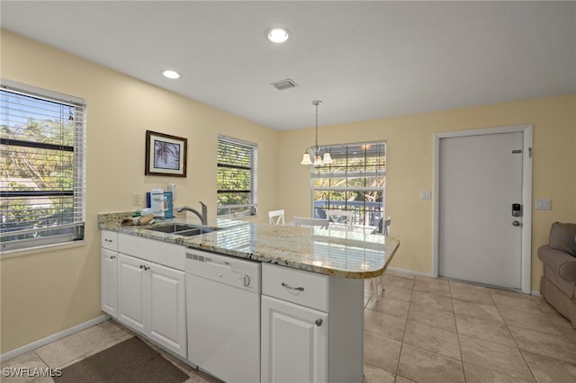 kitchen featuring decorative light fixtures, white cabinets, white dishwasher, and kitchen peninsula