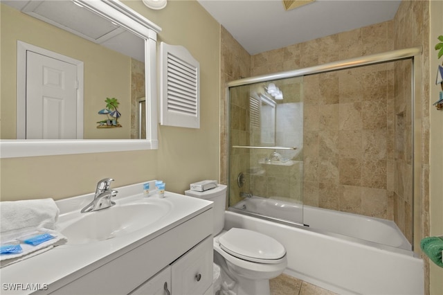 full bathroom with vanity, tile patterned flooring, bath / shower combo with glass door, and toilet