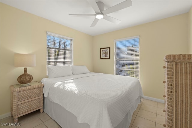 bedroom featuring light tile patterned floors and ceiling fan