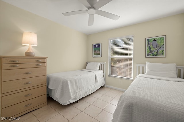 tiled bedroom with ceiling fan