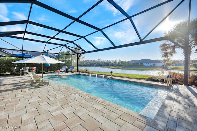 view of swimming pool with a lanai, a patio area, and a water view