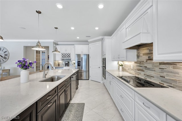 kitchen featuring sink, hanging light fixtures, stainless steel appliances, light stone countertops, and white cabinets