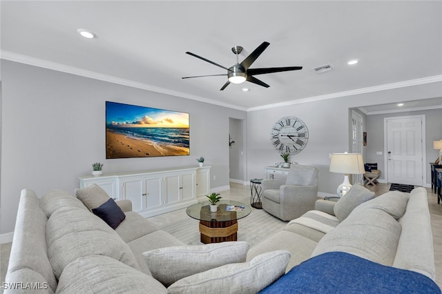 living room featuring ornamental molding and ceiling fan