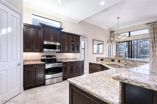 kitchen featuring pendant lighting, sink, crown molding, appliances with stainless steel finishes, and dark brown cabinets