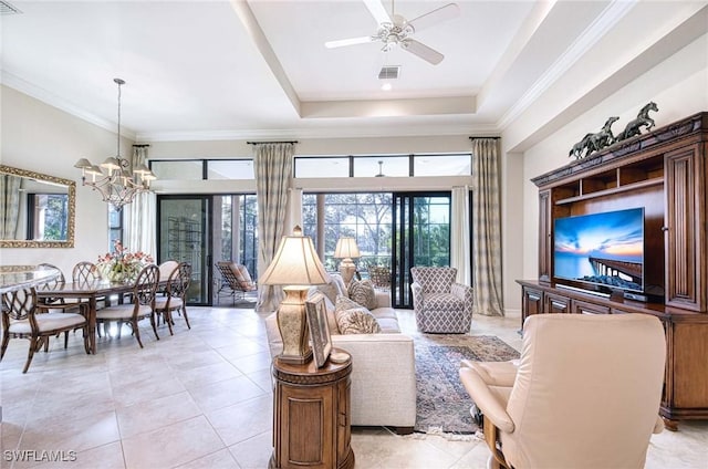 living room featuring crown molding, a raised ceiling, ceiling fan with notable chandelier, and light tile patterned floors