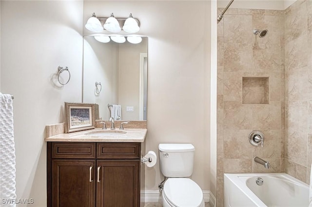 full bathroom with vanity, toilet, and tiled shower / bath combo