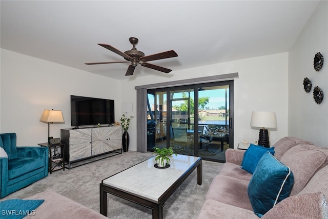 living room featuring light colored carpet and ceiling fan